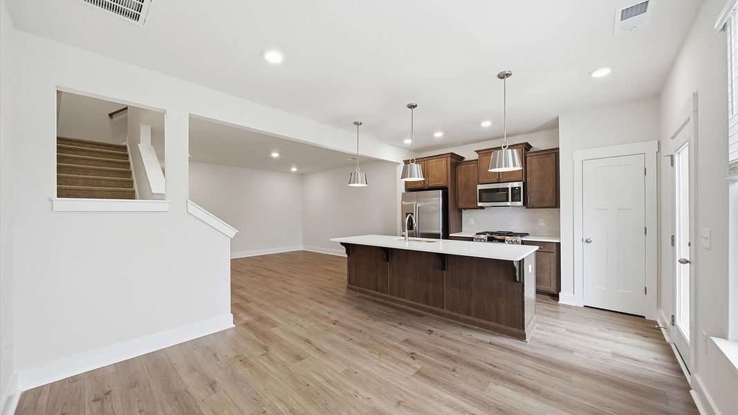 Inviting breakfast area with a seamless connection to the kitchen for everyday living located at Saluda Crossing Inviting breakfast area with a seamless connection to the kitchen for everyday living located at Saluda Crossing