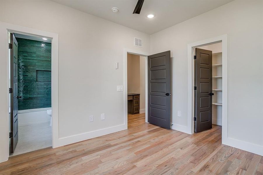 Comfortable secondary bedroom with designer flooring and stylish trim details. Comfortable secondary bedroom with designer flooring and stylish trim details.