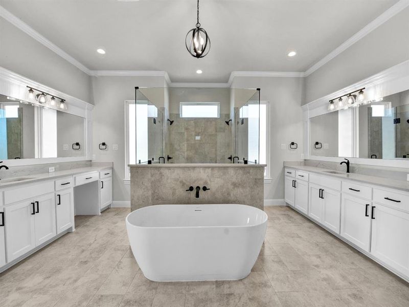 Bathroom with vanity, ornamental molding, and plus walk in shower