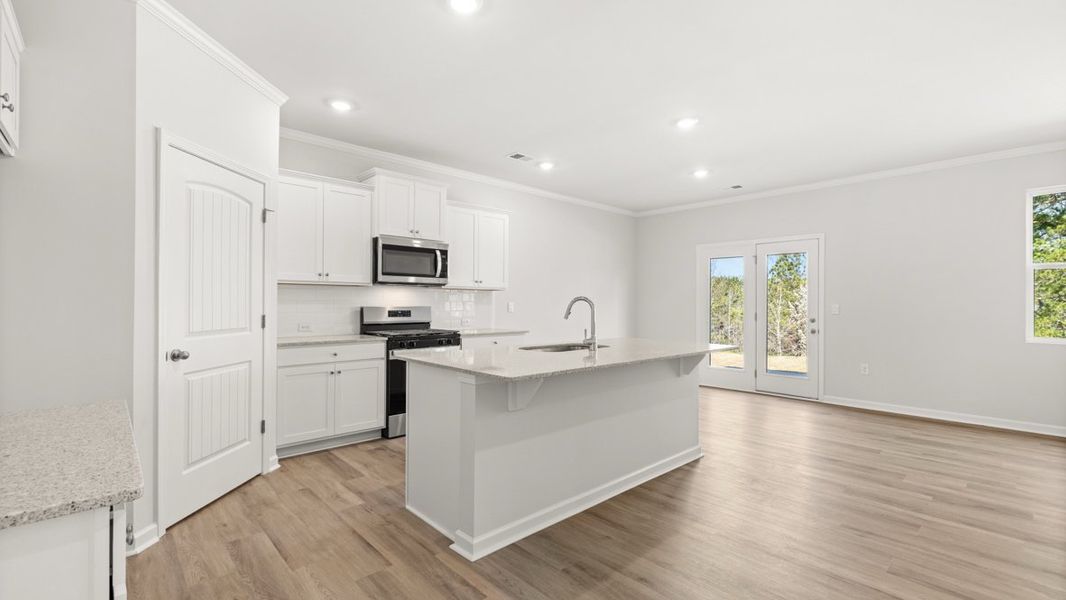 Representative furnished interior of a home built from the Hayden by D.R. Horton in Liberty Crossing, Braselton (Image 6).