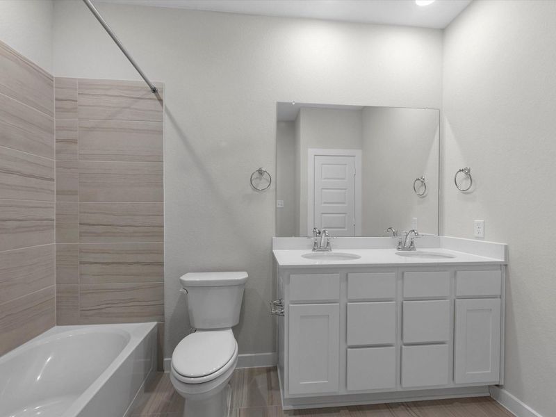 Furnished interior view inside a new home in Mason Woods, Cypress (Image 11).