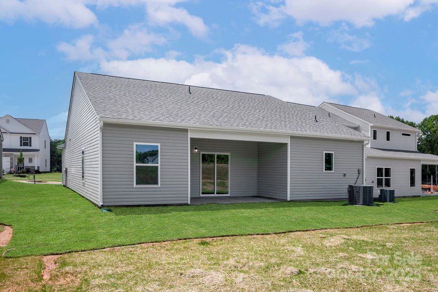 Exterior details and patio area of a home in Ascot Woods, Charlotte (Image 2).