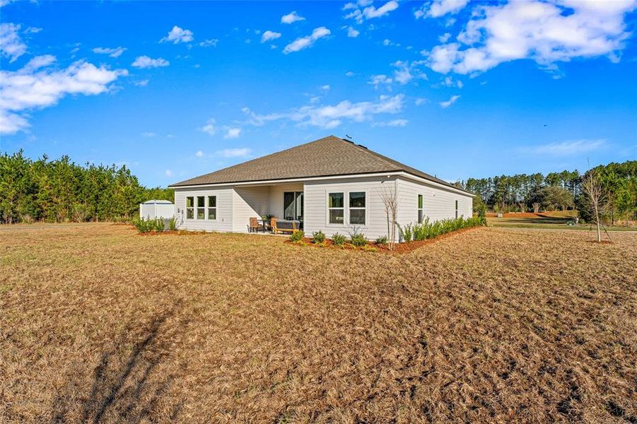 Front exterior of a new home in The Cypress Series at Reserve East, Flagler Beach, FL, highlighting curb appeal (Image 23). Front exterior of a new home in The Cypress Series at Reserve East, Flagler Beach, FL, highlighting curb appeal (Image 23).