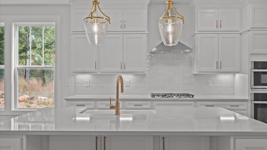 Well-designed kitchen with a center island and tasteful finishes that elevate everyday living