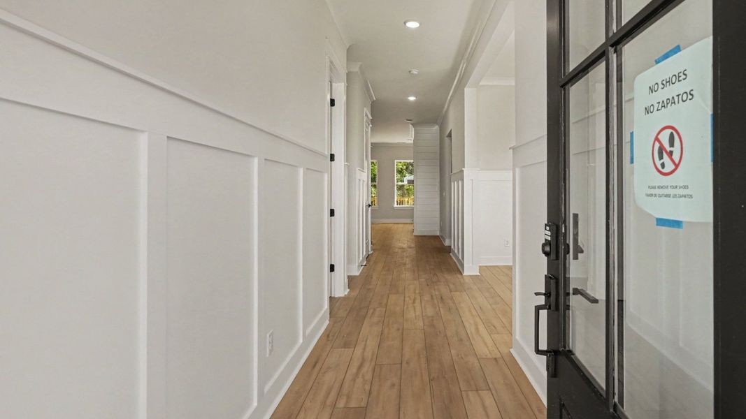 Hallway leading off the front entrance Hallway leading off the front entrance