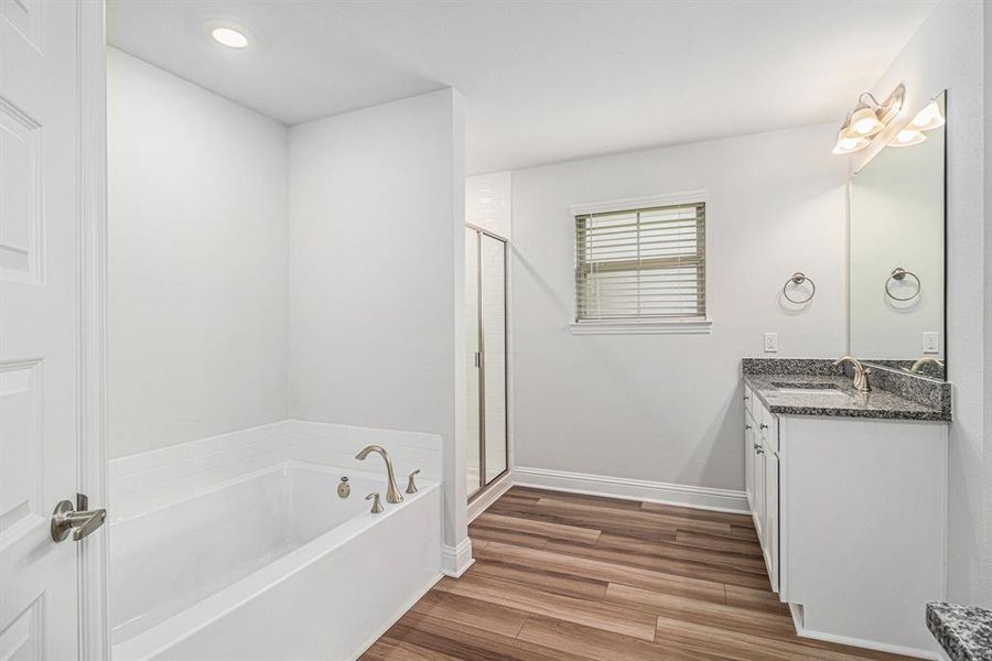 Primary Bathroom with Separate Shower and Bathtub