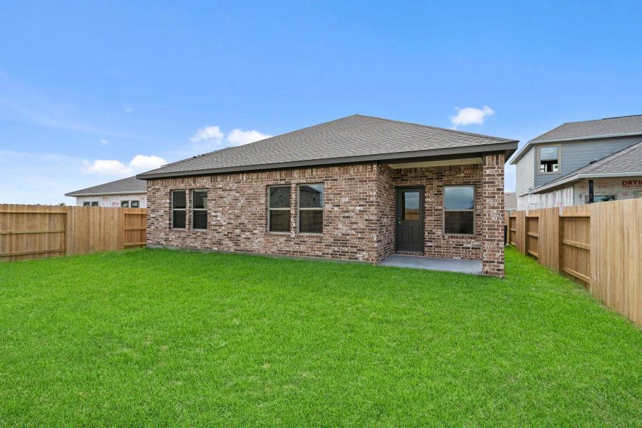 Exterior details and patio area of a home in Windrose Green, Angleton (Image 4).