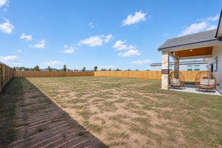 Oversized backyard offering plenty of space for recreation, gardening, or future improvements. Oversized backyard offering plenty of space for recreation, gardening, or future improvements.