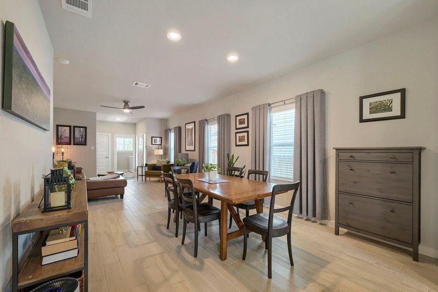 Recessed lighting illuminates an open-concept living space with light wood flooring and plentiful natural light. Recessed lighting illuminates an open-concept living space with light wood flooring and plentiful natural light.