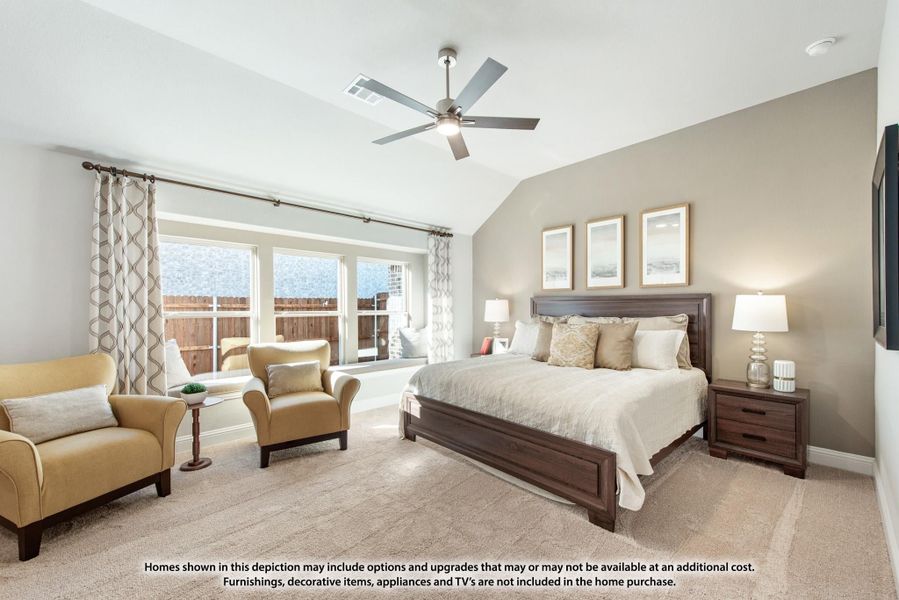 Master bedroom with vaulted ceiling, ceiling fan, large windows, and sitting area with two armchairs Master bedroom with vaulted ceiling, ceiling fan, large windows, and sitting area with two armchairs