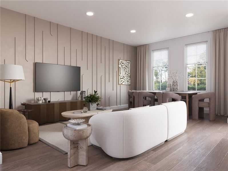 The inviting living space is filled with light. **Please note photos shown are renderings of the floorplan and are not photos of the actual home.