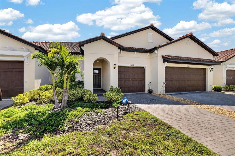 Front exterior of a new home in Southshore Bay Active Adult, Wimauma, FL, highlighting curb appeal (Image 27).