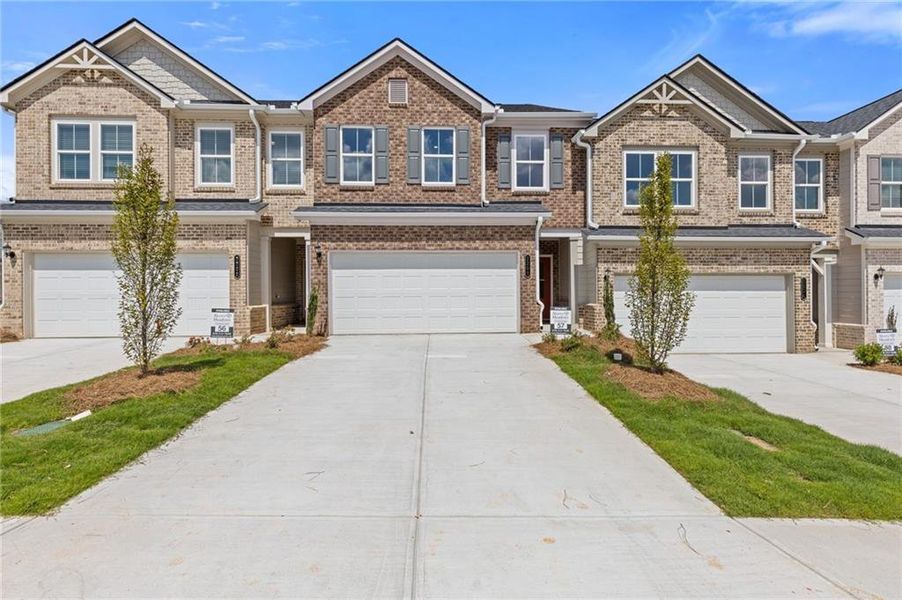 Front exterior of a new home in , Dacula, GA, highlighting curb appeal (Image 7).