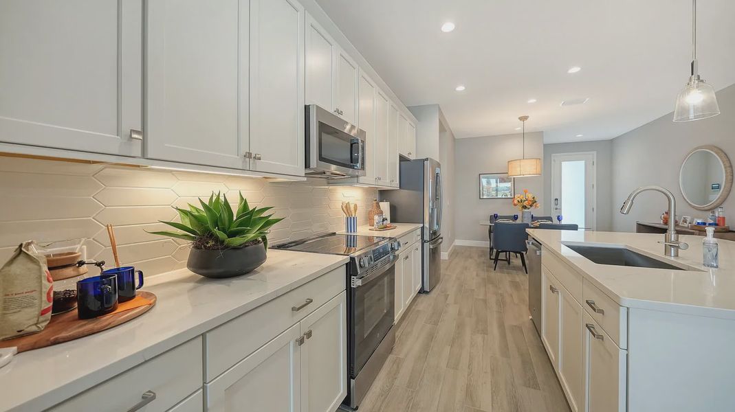Representative furnished interior of a home built from the Avery by Neal Communities in SkySail, Naples (Image 22).
