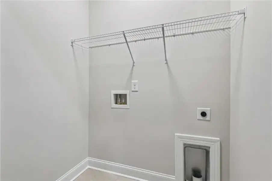 Laundry area with electric dryer hookup and hookup for a washing machine ~ Photos shown are of previously finished home and for viewing purpose only ~ Laundry area with electric dryer hookup and hookup for a washing machine ~ Photos shown are of previously finished home and for viewing purpose only ~