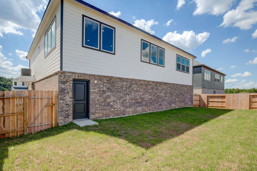 Front exterior of a new home in Townsen Landing, Humble, TX, highlighting curb appeal (Image 2).