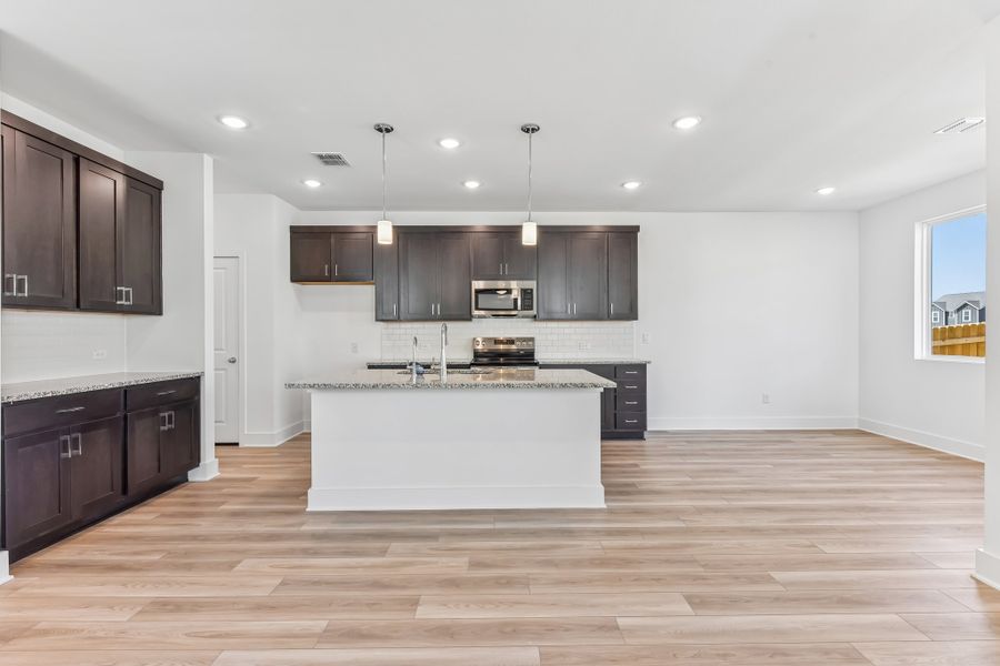 Furnished interior view inside a new home in Freedom at Anthem, Kyle (Image 3).