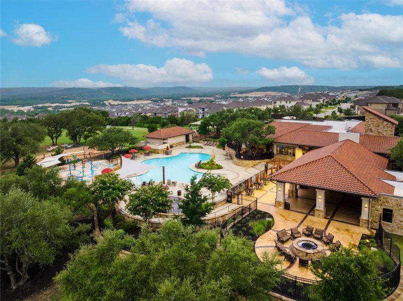 Aerial view of residential area featuring a pool