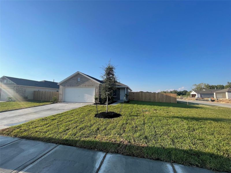 Front exterior of a new home in Valor Park, Bay City, TX, highlighting curb appeal (Image 9).