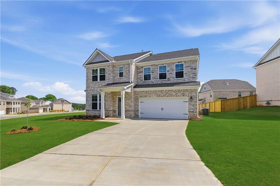 Front exterior of a new home in Burchwood, Stockbridge, GA, highlighting curb appeal (Image 17).