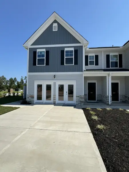 Front exterior of a new home in The Falls, Blythewood, SC, highlighting curb appeal (Image 26).