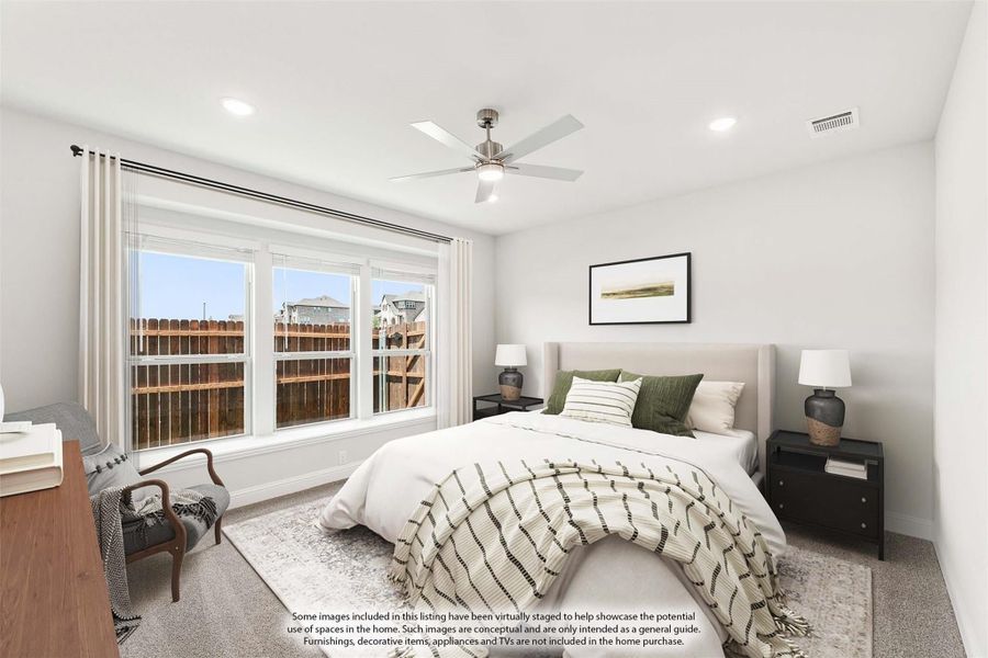 Bedroom with ceiling fan, large window, carpet flooring, and neutral decor including a queen bed and nightstands