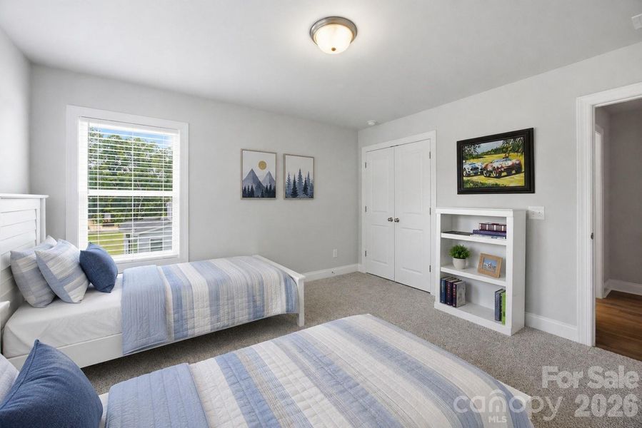 This bedroom is located at the back of the home near the Primary bedroom