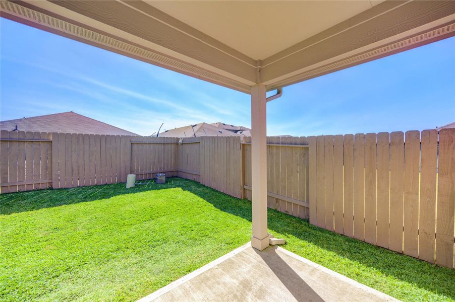 Exterior details and patio area of a home in Breckenridge Forest, Spring (Image 3).
