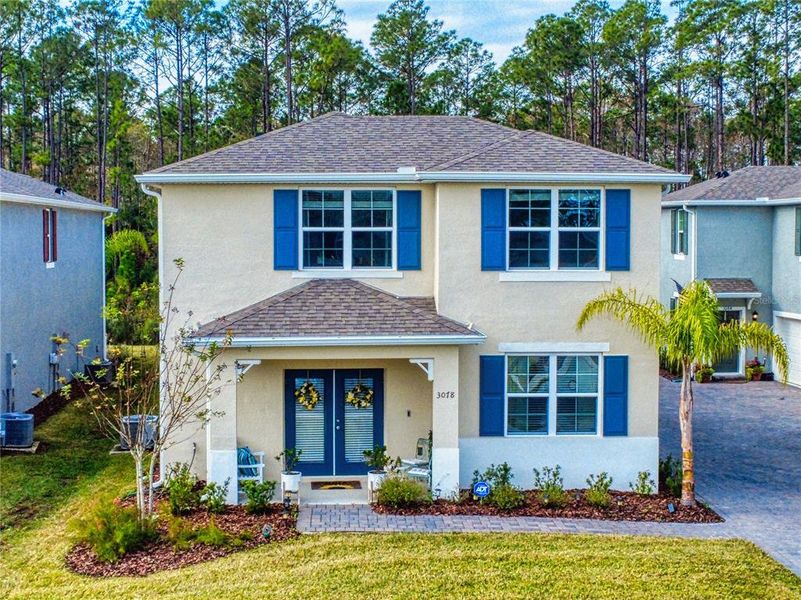 Front exterior of a new home in , New Smyrna Beach, FL, highlighting curb appeal (Image 2). Front exterior of a new home in , New Smyrna Beach, FL, highlighting curb appeal (Image 2).