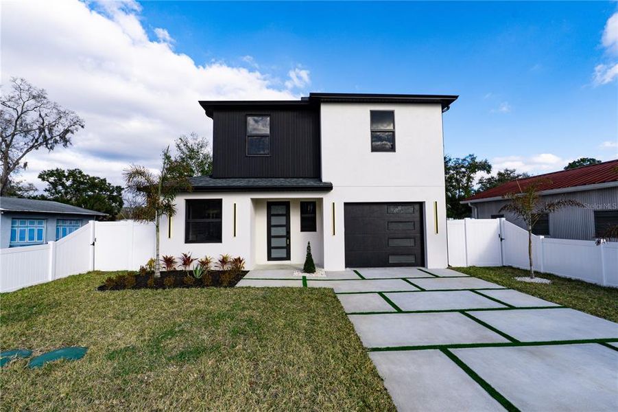 Front exterior of a new home in , Tampa, FL, highlighting curb appeal (Image 27).