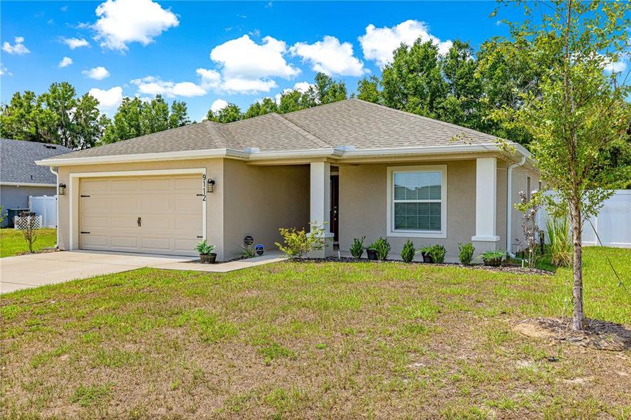 Front exterior of a new home in , Ocala, FL, highlighting curb appeal (Image 2). Front exterior of a new home in , Ocala, FL, highlighting curb appeal (Image 2).