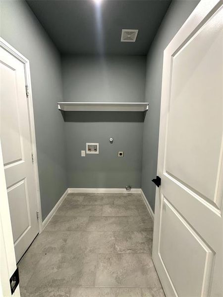 Washroom featuring electric dryer hookup, washer hookup, and hookup for a gas dryer