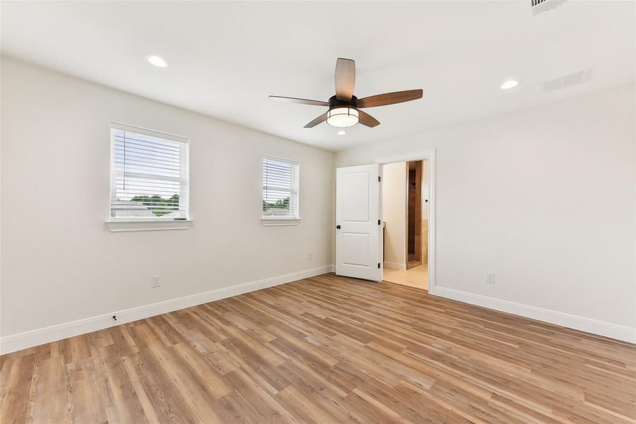Bedroom 3 with light wood-type flooring, baseboards, visible vents, and recessed lighting Bedroom 3 with light wood-type flooring, baseboards, visible vents, and recessed lighting