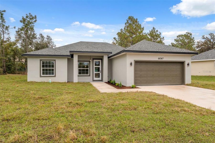 Front exterior of a new home in , Ocala, FL, highlighting curb appeal (Image 19).