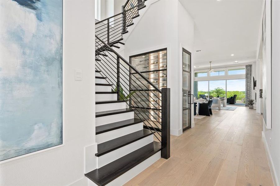 Stairs with wood finished floors and recessed lighting Stairs with wood finished floors and recessed lighting