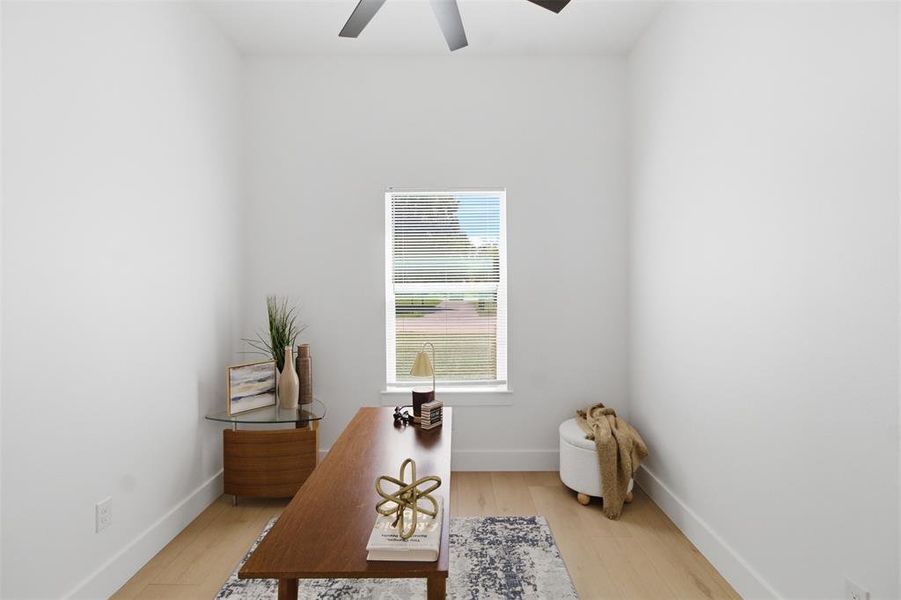 Light wood-finish flooring complements the crisp white walls
