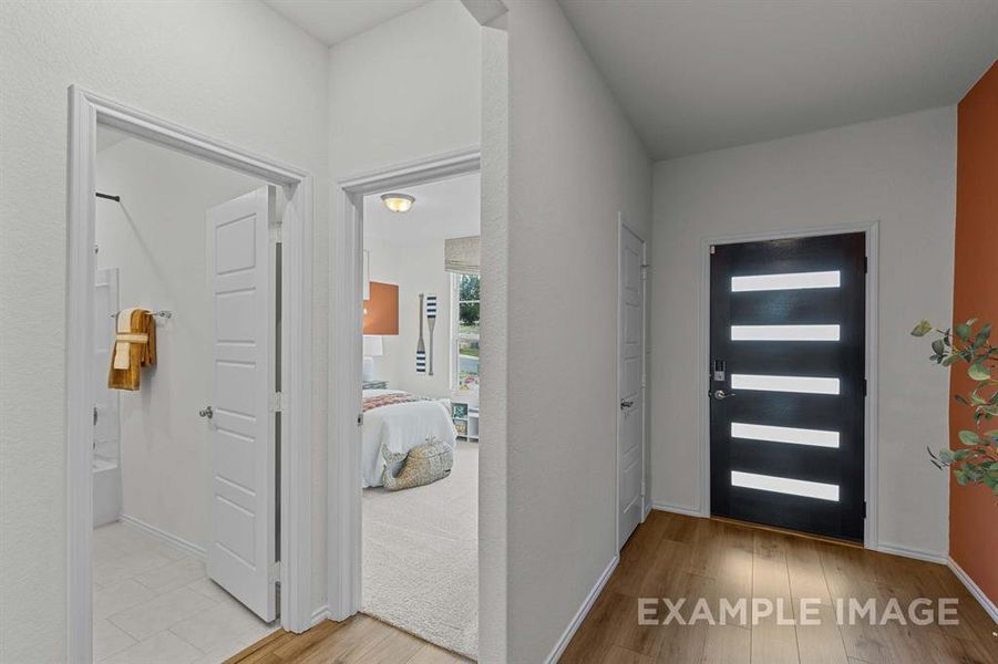 Foyer with light hardwood / wood-style flooring