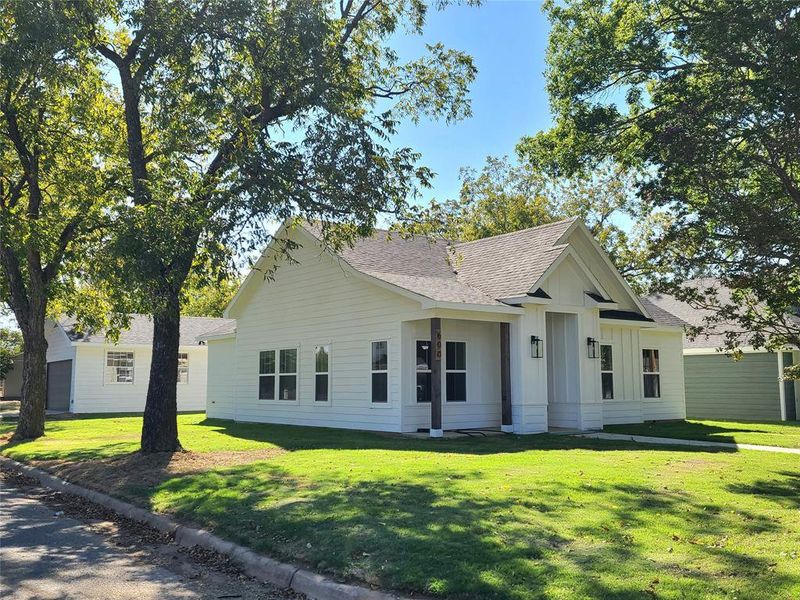 View of front of property with a front lawn