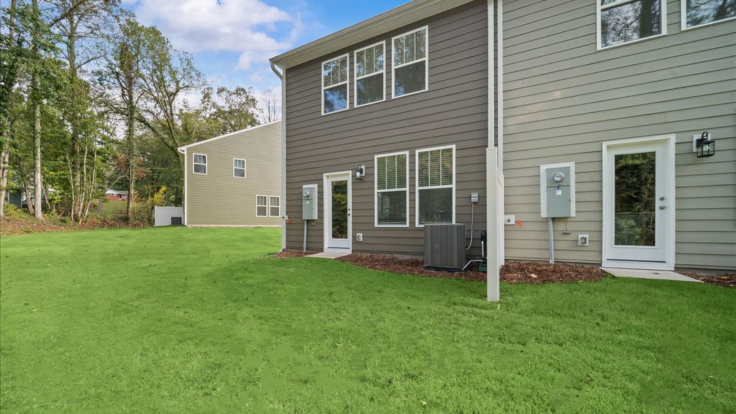 Exterior details and patio area of a home in Clayton Crossing, Arden (Image 2). Exterior details and patio area of a home in Clayton Crossing, Arden (Image 2).