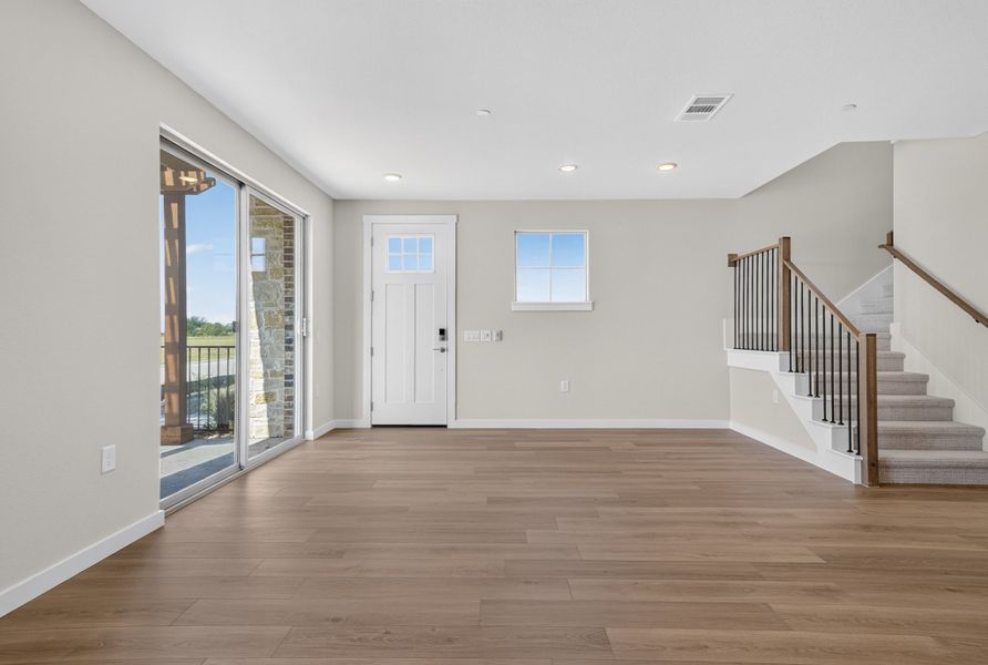 Spacious, unfurnished interior of a new home in The Tribute, The Colony (Image 25).