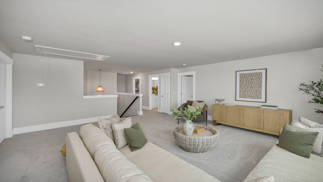 Representative furnished interior of a home built from the Harbor Oak by D.R. Horton in Lake Tide Summit, Chapin (Image 33).