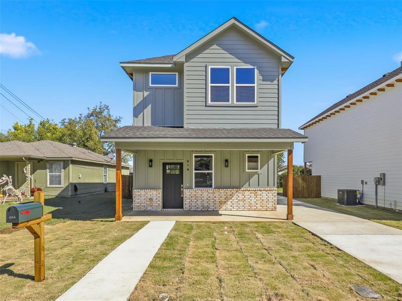 Front exterior of a new home in , Cleburne, TX, highlighting curb appeal (Image 2).