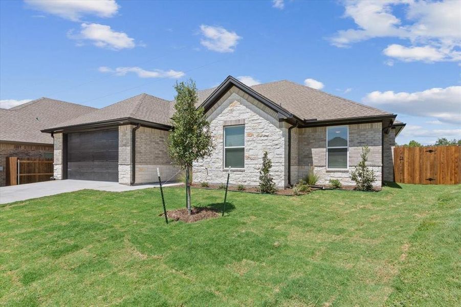 Front exterior of a new home in , Hewitt, TX, highlighting curb appeal (Image 17).