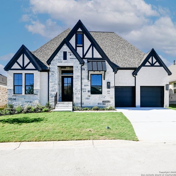 Front exterior of a new home in Veramendi 60', New Braunfels, TX, highlighting curb appeal (Image 20).
