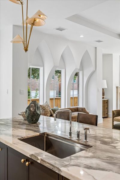 Generously sized slab marble top Kitchen island with deep sink and abundant storage Generously sized slab marble top Kitchen island with deep sink and abundant storage