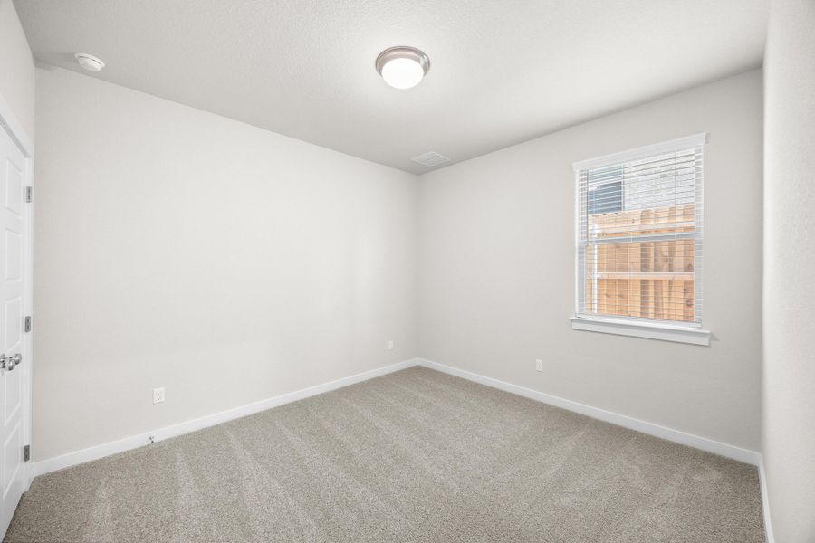 Bedroom in the Elm home plan by Trophy Signature Homes – REPRESENTATIVE PHOTO Bedroom in the Elm home plan by Trophy Signature Homes – REPRESENTATIVE PHOTO