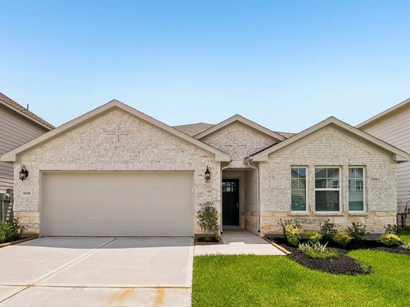 Front exterior of a new home in Riviera Pines - Classic Series, Huffman, TX, highlighting curb appeal (Image 1). Front exterior of a new home in Riviera Pines - Classic Series, Huffman, TX, highlighting curb appeal (Image 1).