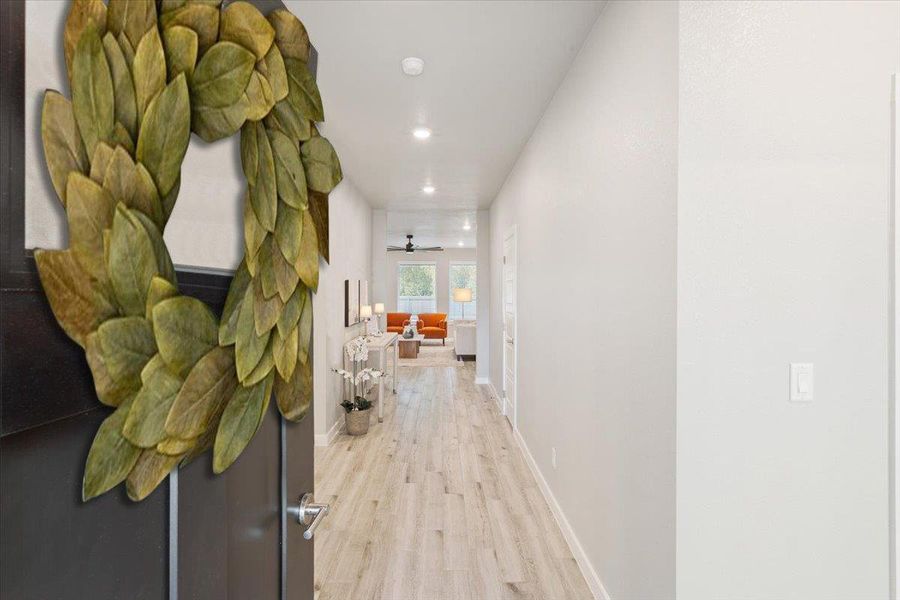 Hall featuring light wood-type flooring and recessed lighting Hall featuring light wood-type flooring and recessed lighting