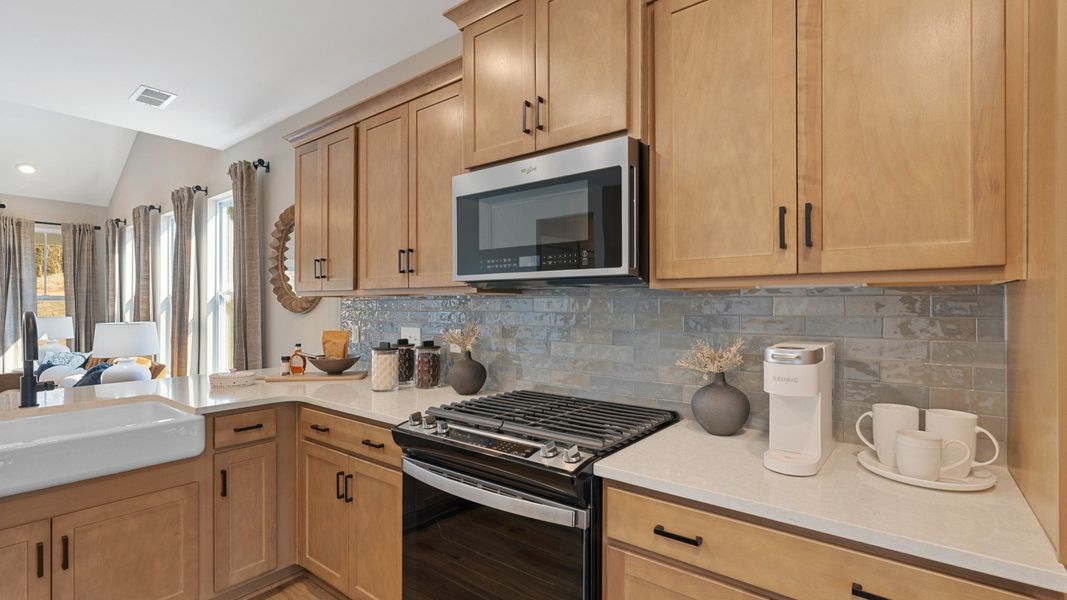 Designer kitchen showcasing quartz countertops and sleek cabinetry of the Finley Design