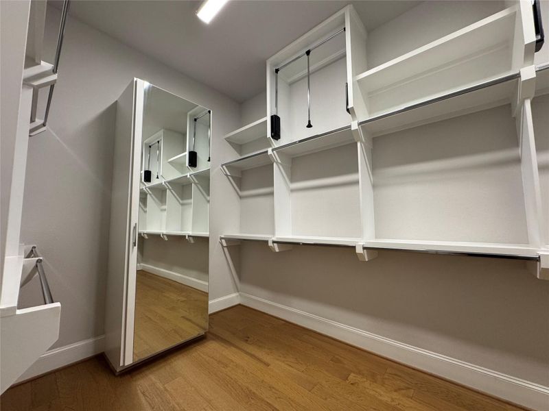 Primary closet (1 of 2) is the size of a bedroom! Note the pull-down rods and full length mirror on door to chest of drawers! Primary closet (1 of 2) is the size of a bedroom! Note the pull-down rods and full length mirror on door to chest of drawers!